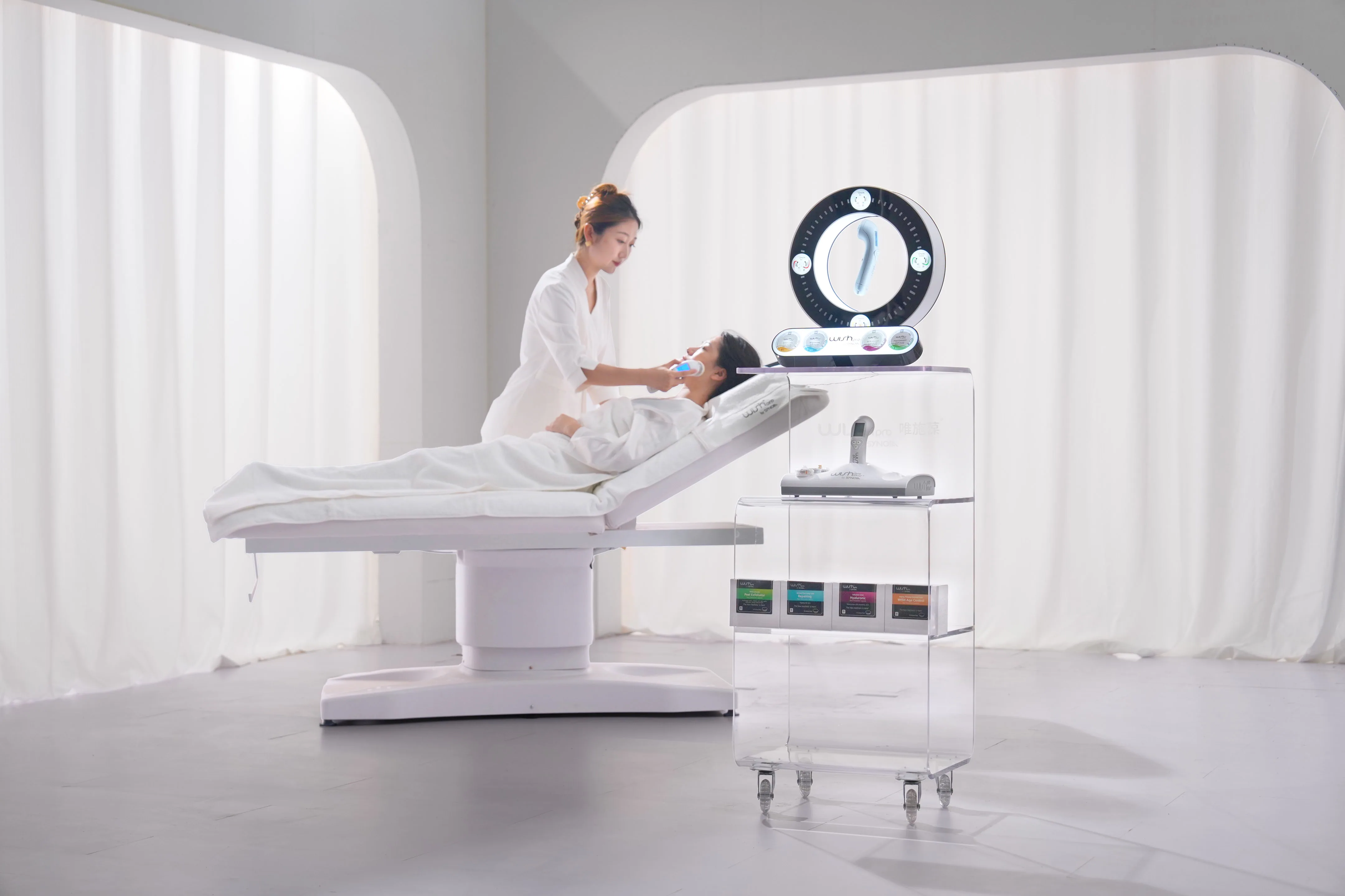 A certified cosmetician performing a WISHpro session in a professional studio